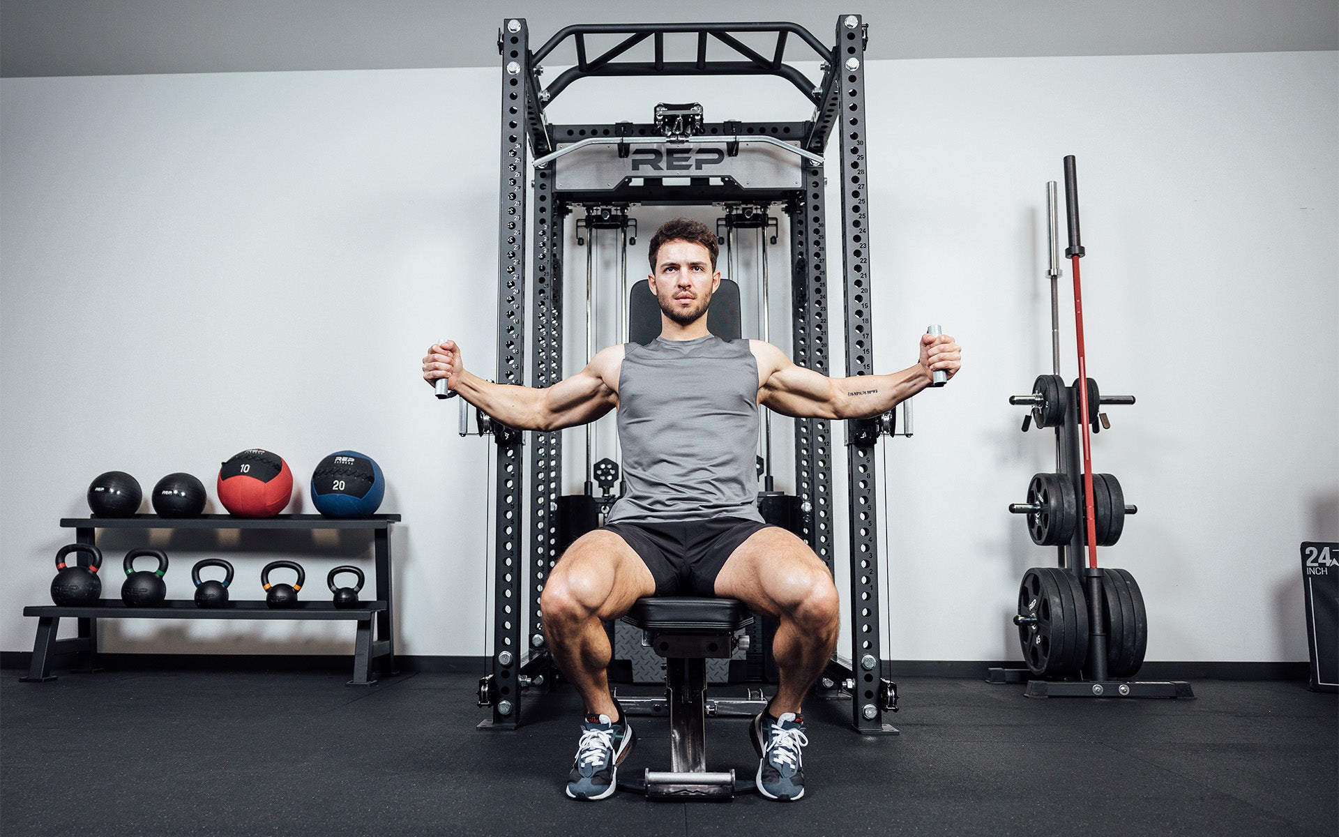 Man doing seated flies using the Ares 2.0