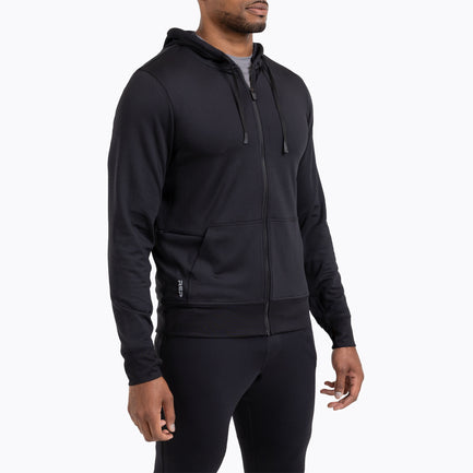 A man wearing the Attis Jacket in 
Heather Black