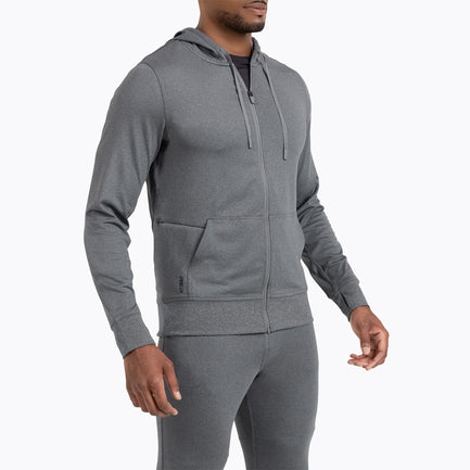 A man wearing the Attis Jacket in 
Heather Cool Gray