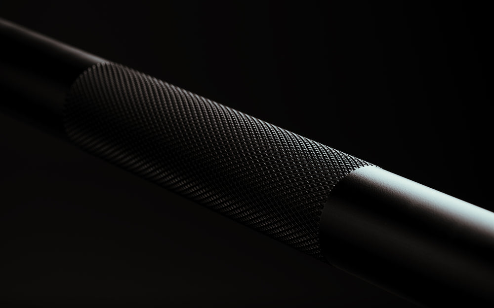 Close-up view of the center knurling on a Black Cerakote Black Diamond Power Bar.