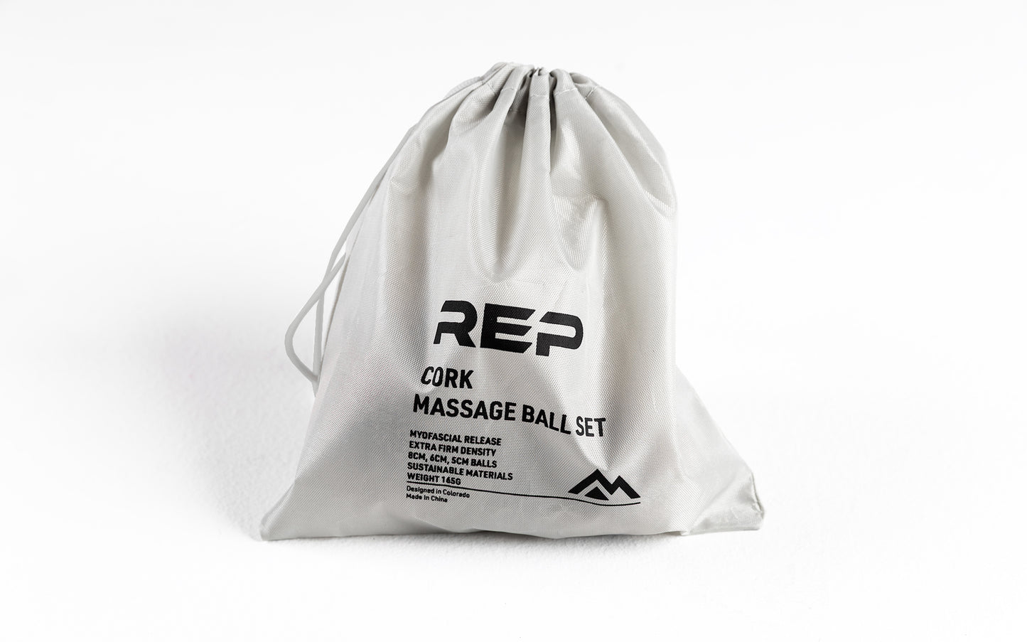 Studio-shot: REP Cork Massage Ball Set drawstring carrying bag closed with the balls inside.