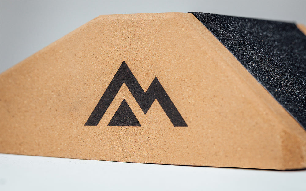 Close up of the Mountain logo on the side of the Cork Squat Wedge