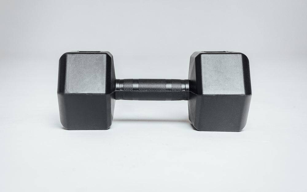 Side view of a Rubber Coated Hex Dumbbell showing the hexagon heads and the center-knurled ergonomic handle.