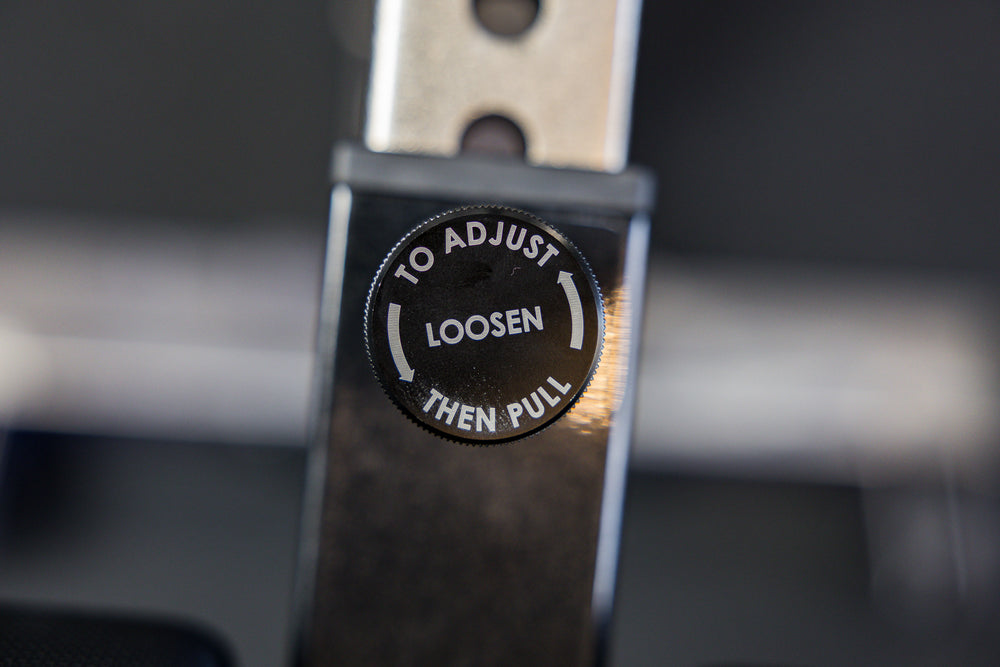 Close-up shot of the adjustment pin on the Adjustable Bench Leg Roller Attachment 2.0