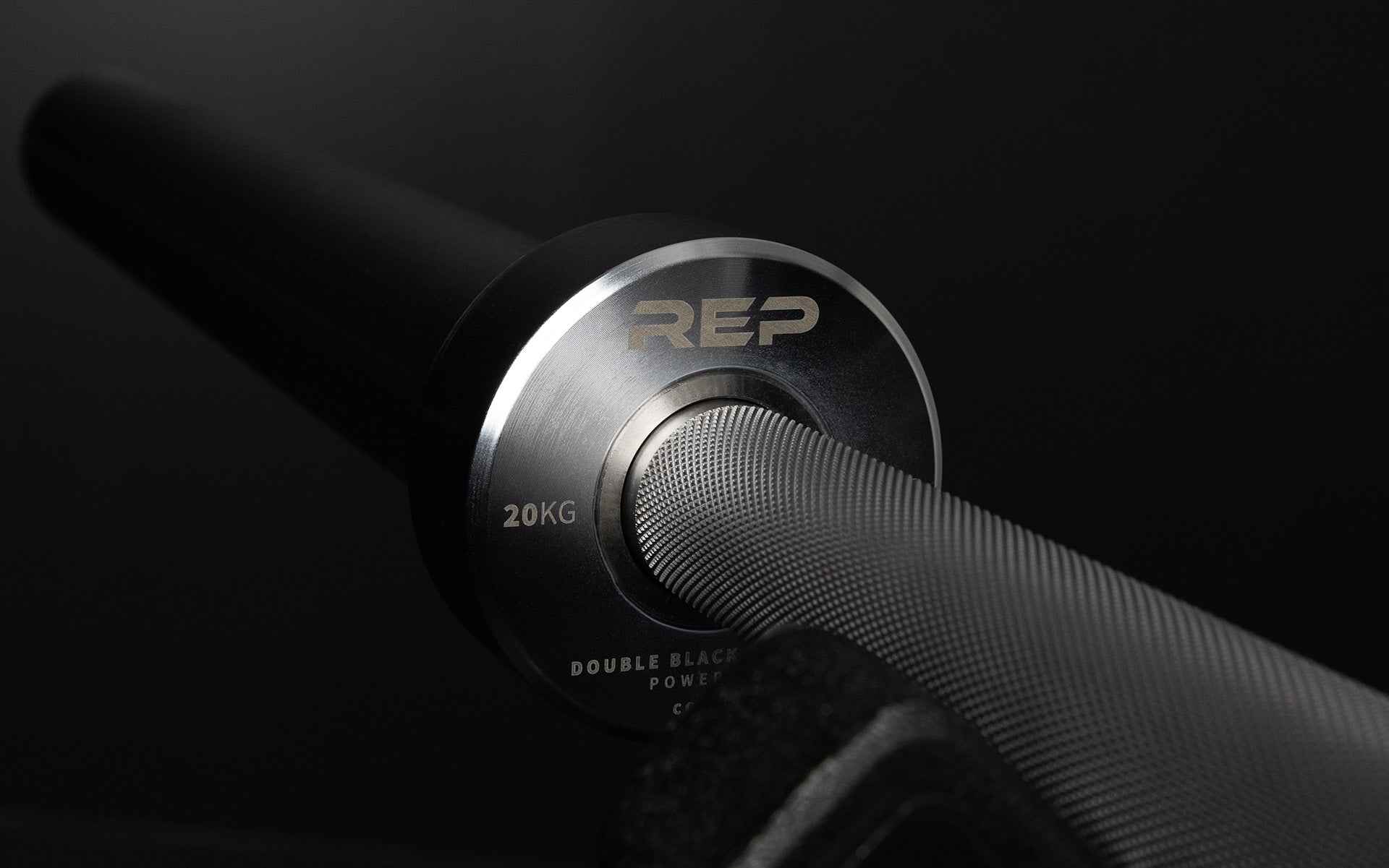Close-up view of the laser-etched labeling on the inside of the sleeve of a REP Double Black Diamond Power Bar.