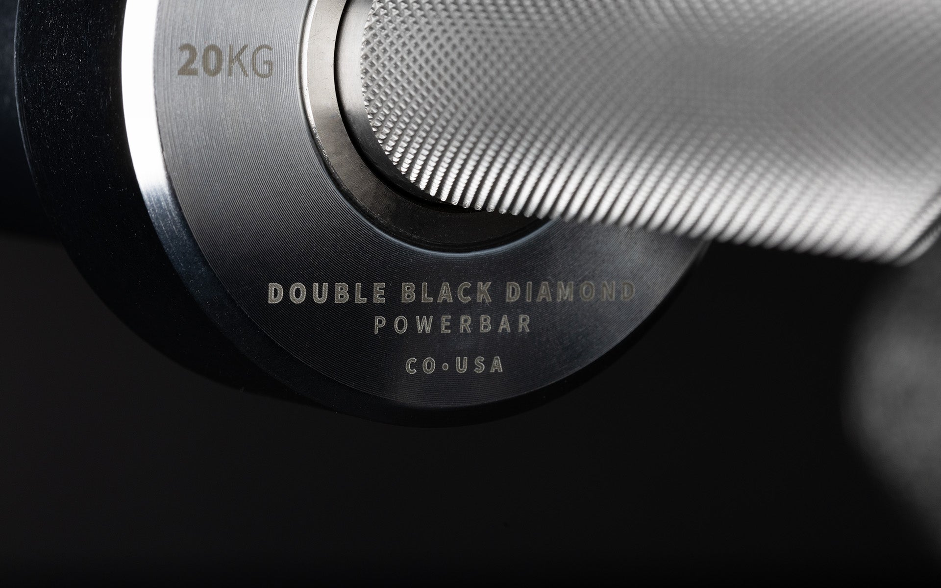 Close-up view of the laser-etched labeling on the inside of the sleeve of a REP Double Black Diamond Power Bar.