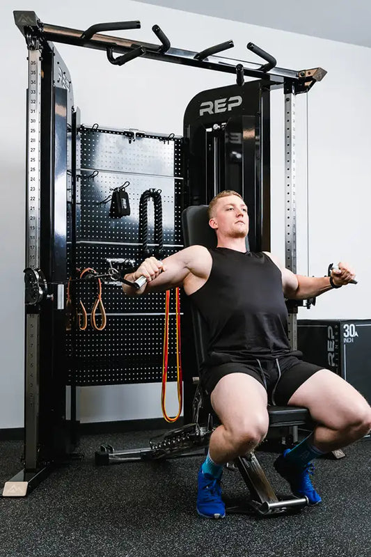 Cable Machines - Man using a REP Arcadia Functional Trainer  in a gym setting
