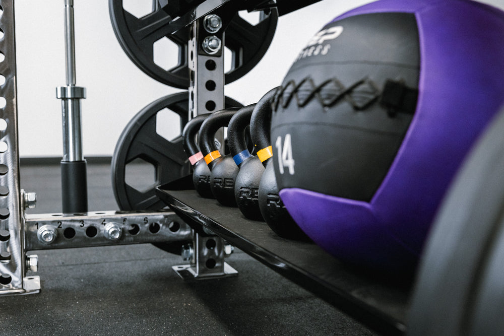 In-Rack Storage showing kettlebells and medicine ball on the Flat Storage Shelf