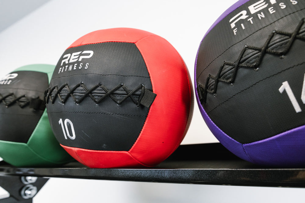 Kettlebell Storage Shelf - Versatility - Showing medicine balls being stored on the shelf