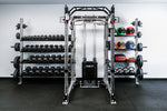 Off-Rack Storage - showing a dual-sided configuration. 41" Shelves coming off the right side and 72" off of the left side. Storage shelves holding dumbbells, medicine balls, weight belt, kettlebells, and small accessories