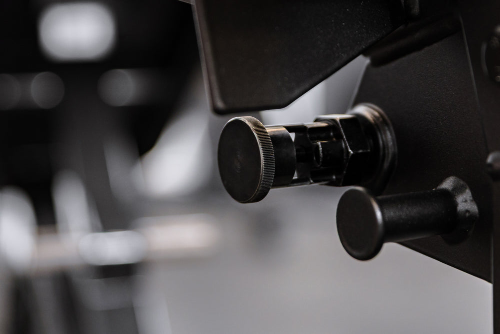 A second angle of the Leg Extension & Leg Curl Bench Attachment lock-pin