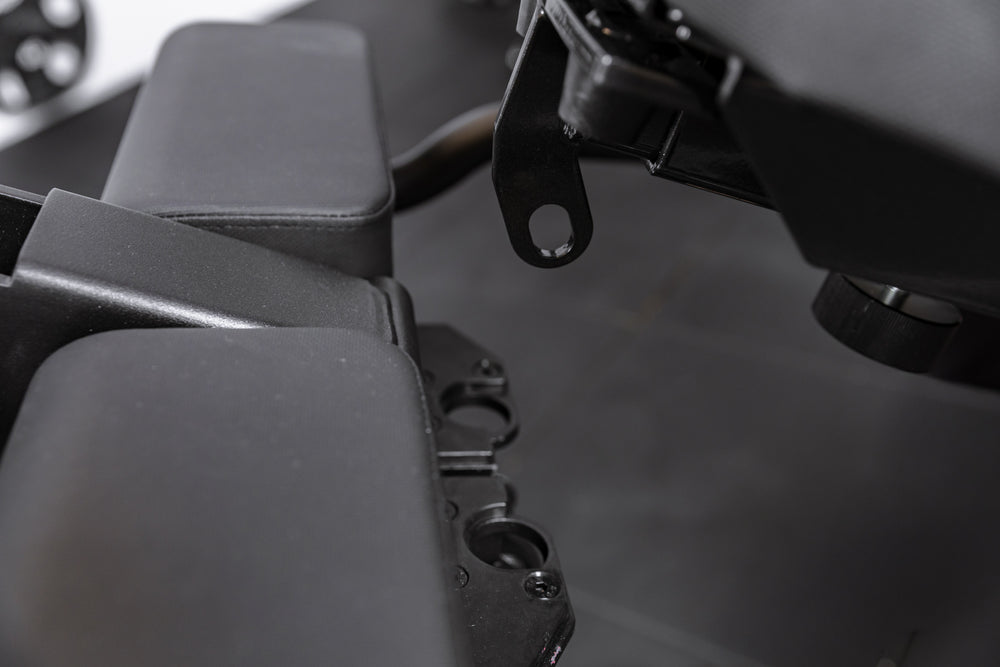 Close up of the Leg Extension & Leg Curl Bench Attachment adapter