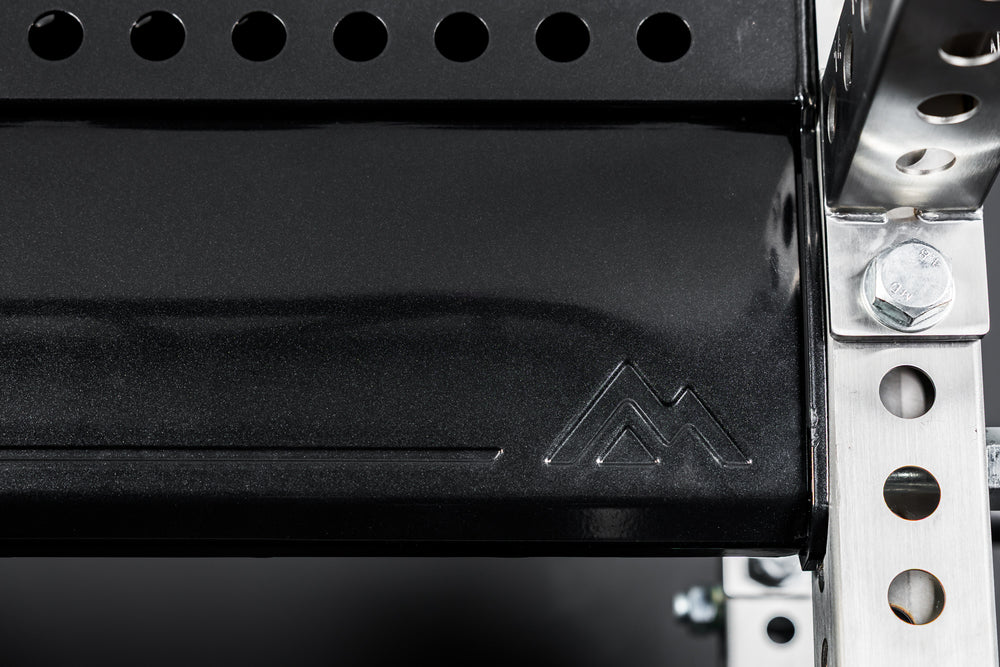 Close-up of mountain branding on the stamped REP Logo Plate Crossmember 2.0