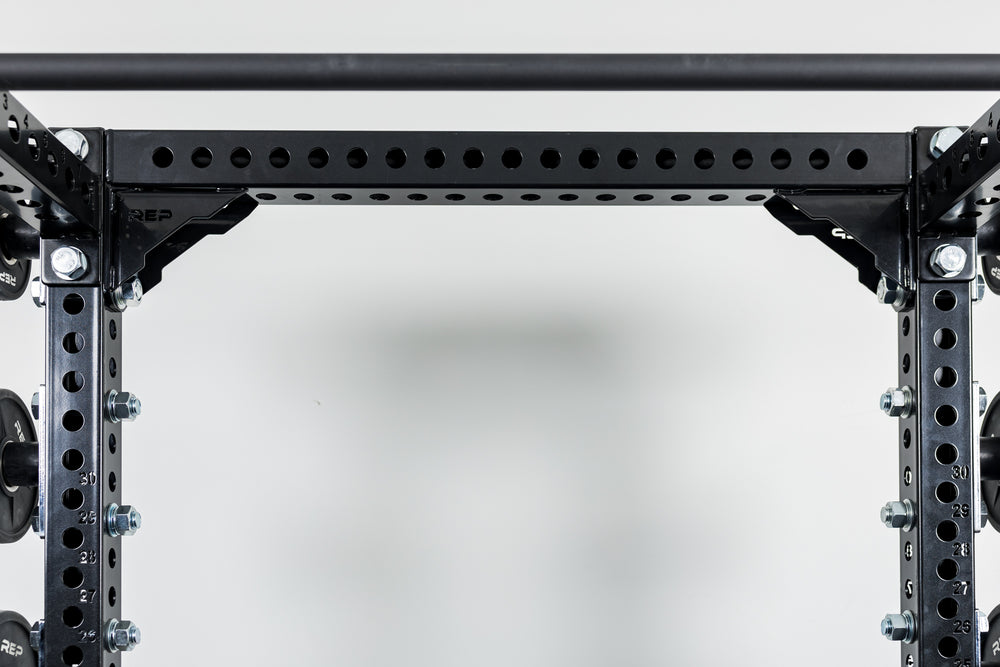 Close-Up of Compact Logo Plate Crossmember 2.0 on a REP power rack
