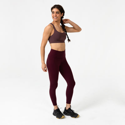 Athlete posing sideways in Cocoa Powder Lattis Bra