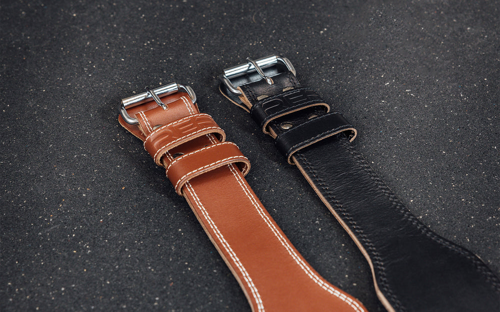 Close-up view of the belt loop and buckle portion of the brown and black REP Leather Olympic Lifting Belts.