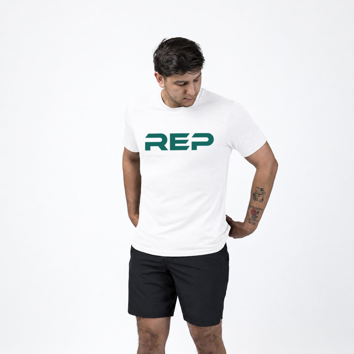 An athlete wearing the REP Fitness Men's Daily Driver 2.0 Tri-Blend Crew T-Shirt in White/Green