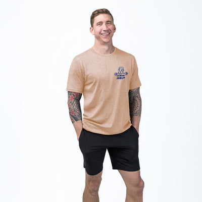 Athlete wearing the REP fitness Deadlift Party Tri-Blend Crew T-Shirt in Heather Peach/Blue