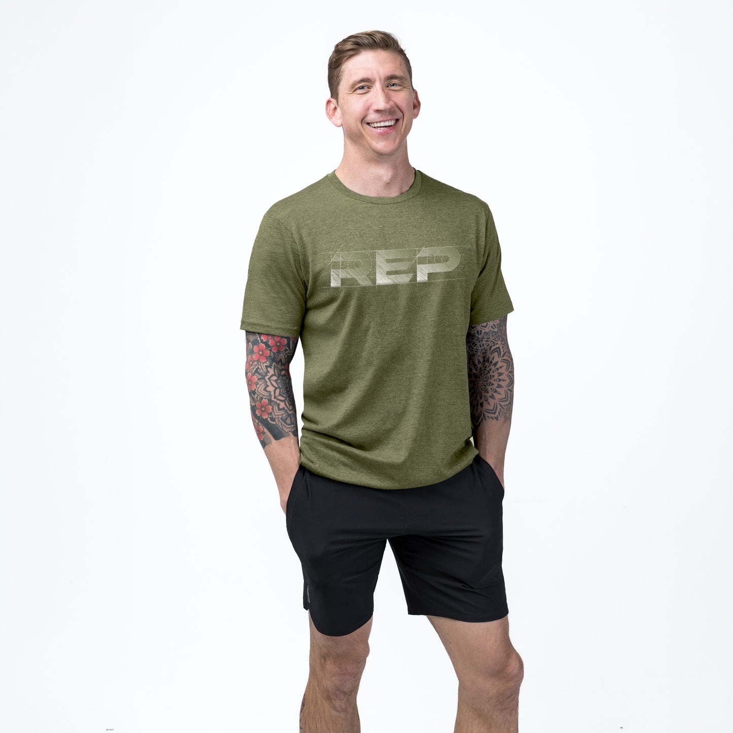 Athlete wearing REP fitness blueprint Tri-Blend Crew t-shirt in Heather Olive/White