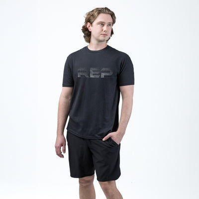 Athlete wearing REP fitness blueprint Tri-Blend Crew t-shirt in Heather Black/White