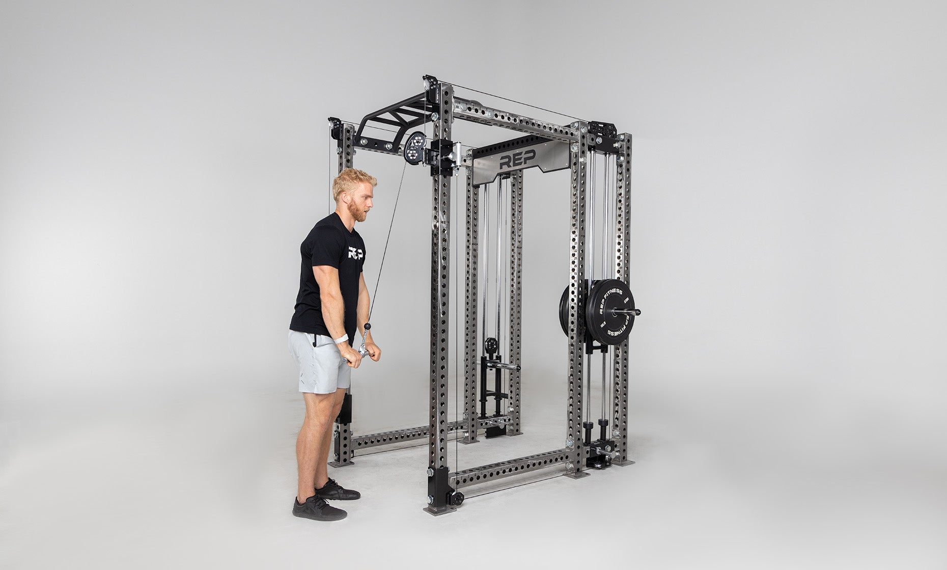 Athena Plate-Loaded Side-Mount Functional Trainer Dual Side Shown on Clear Coat PR-5000 Power Rack Being Used for Tricep Pushdowns