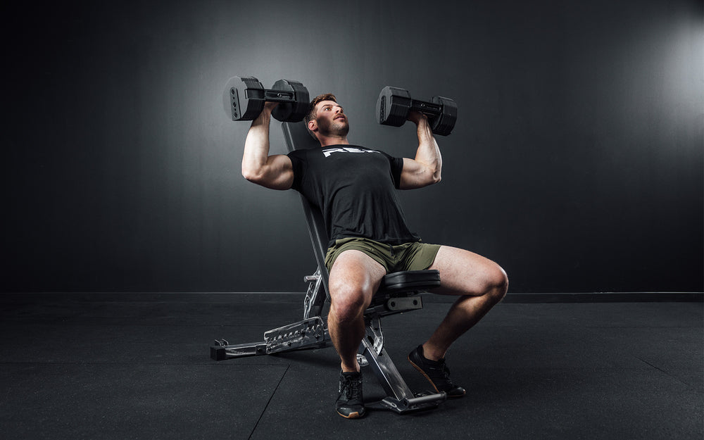 Athlete performing incline bench press with a pair of REP x PÉPIN FAST Series Adjustable Dumbbells.