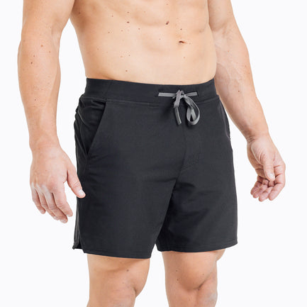 Front view of model wearing the Black REP Pinnacle Shorts.