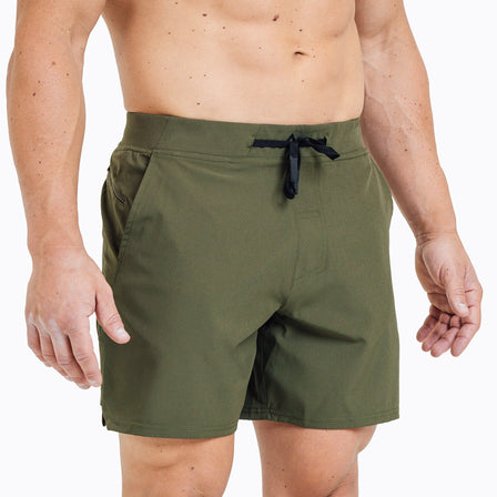 Front view of model wearing the olive REP Pinnacle Shorts.