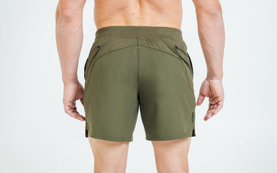 Back view of model wearing the Olive REP Pinnacle Shorts.