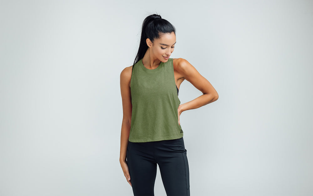 Woman wearing Heather Olive/Black Peak Cropped Dual-Blend Tank