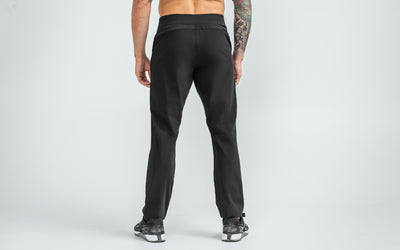 Back view of model wearing the black REP Felix Pants