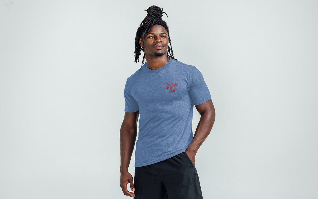 The REP Fitness Men's Liberty Bell Tri-Blend Crew T-Shirt in Heather Blue/Red front