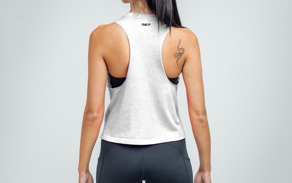 Woman wearing White/Black Peak Cropped Dual-Blend Tank - Back view