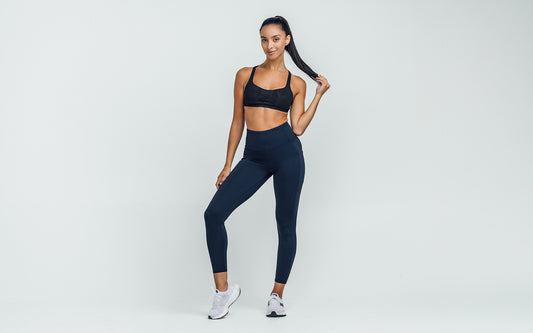 Women's Leggings- Front view of model wearing the REP Hera Tights in Navy on a gray background