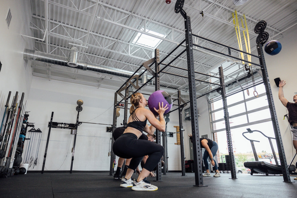 Athletes using Rig for Wall Balls and more