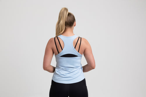 Athlete wearing a periwinkle REP Women’s Clio Tank Top.