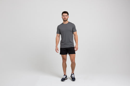 Athlete wearing a cool gray REP Men's Delta Tee.