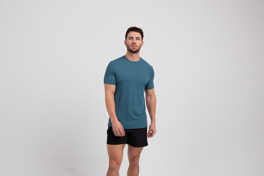 Athlete wearing a slate REP Men's Delta Tee.