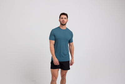 Athlete wearing a slate REP Men's Delta Tee.