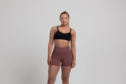 Athlete wearing the mauve REP Women’s Forma Shorts.