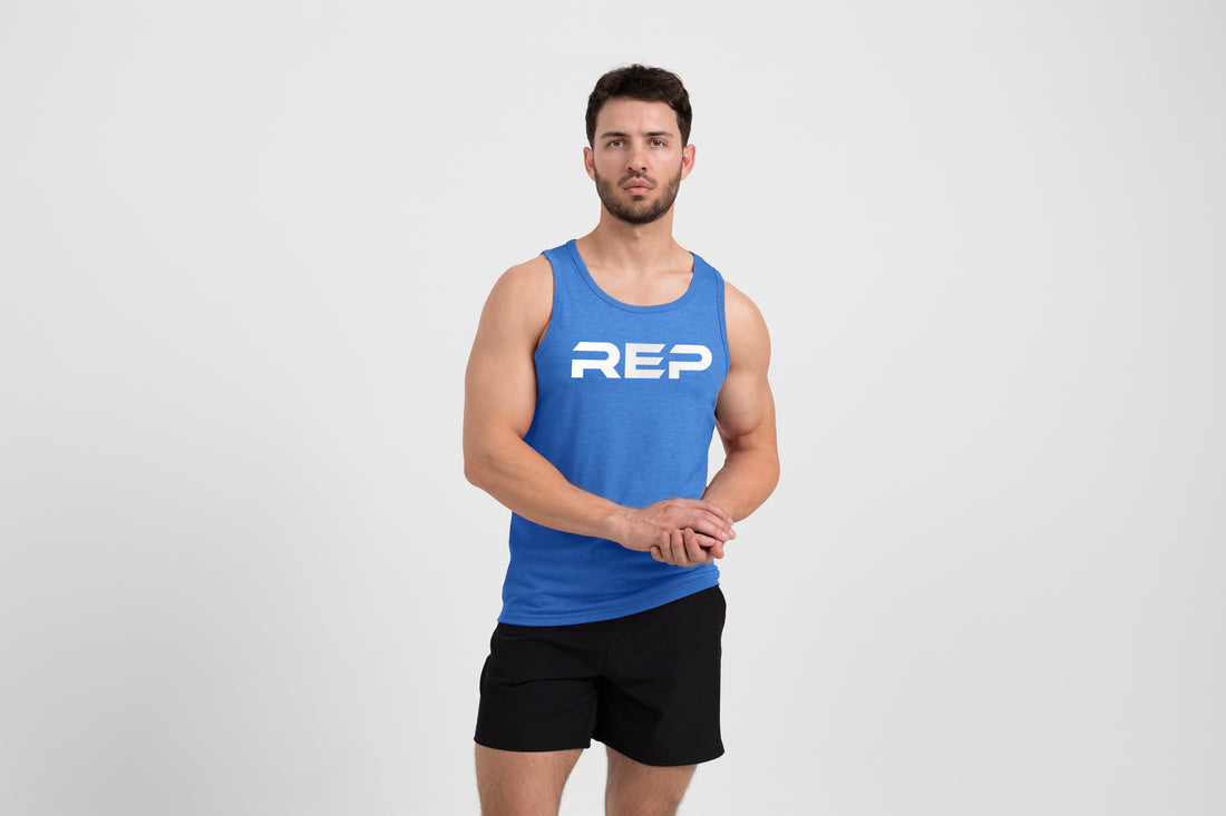 The REP Fitness Men's Daily Driver Tri-Blend Tank in Heather Azure/White fon body