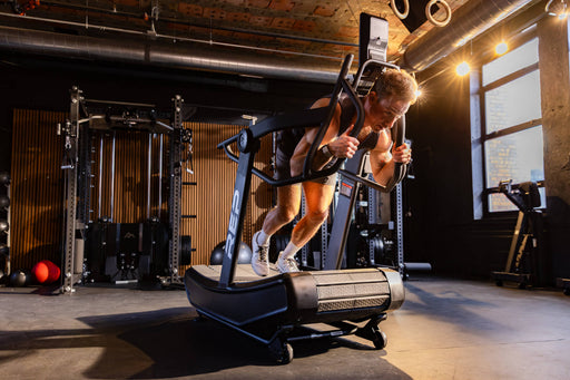 Person using a treadmill in a gym setting