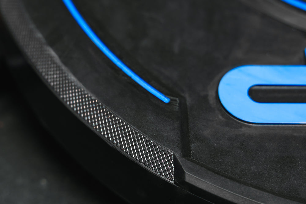 Close-up: Unique textured edges and side cutouts make the REP Sport Bumper Plates 2.0 easy to handle and move