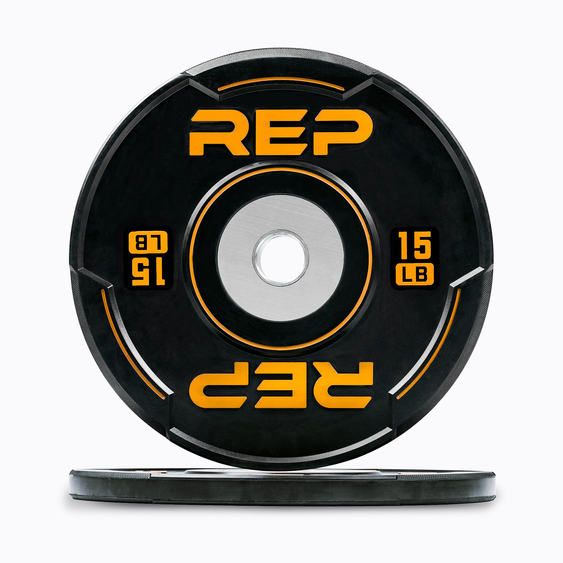 Studio-shot: Front and side profile of an orange 15 lb REP Sport Bumper Plate 2.0 on a white background