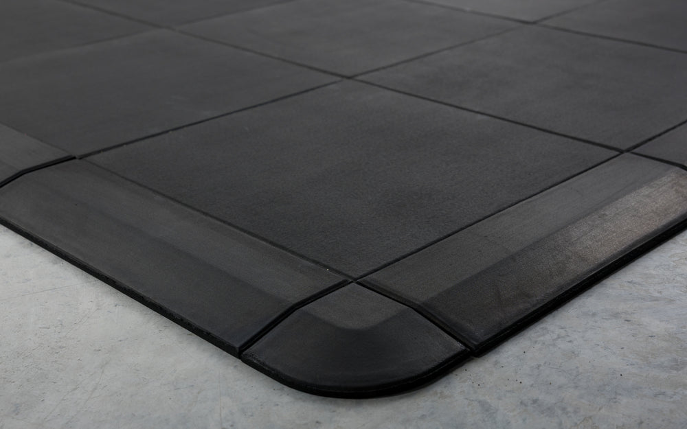 Close-up of the smooth transition that the corner and border pieces provide for the Interlocking Floor Tiles
