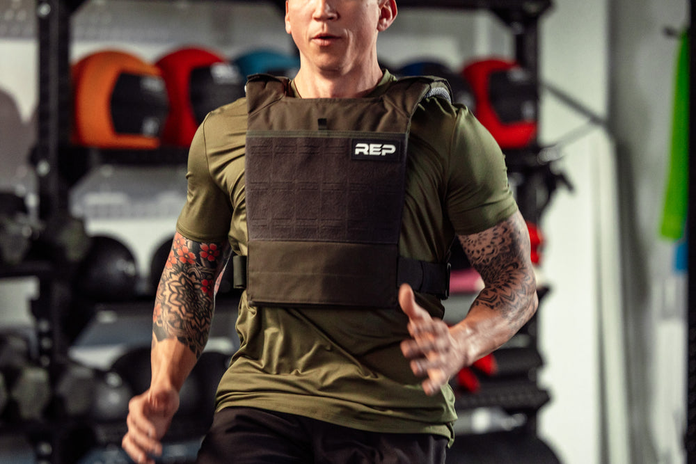 Athlete wearing the olive Strata Weight Vest running