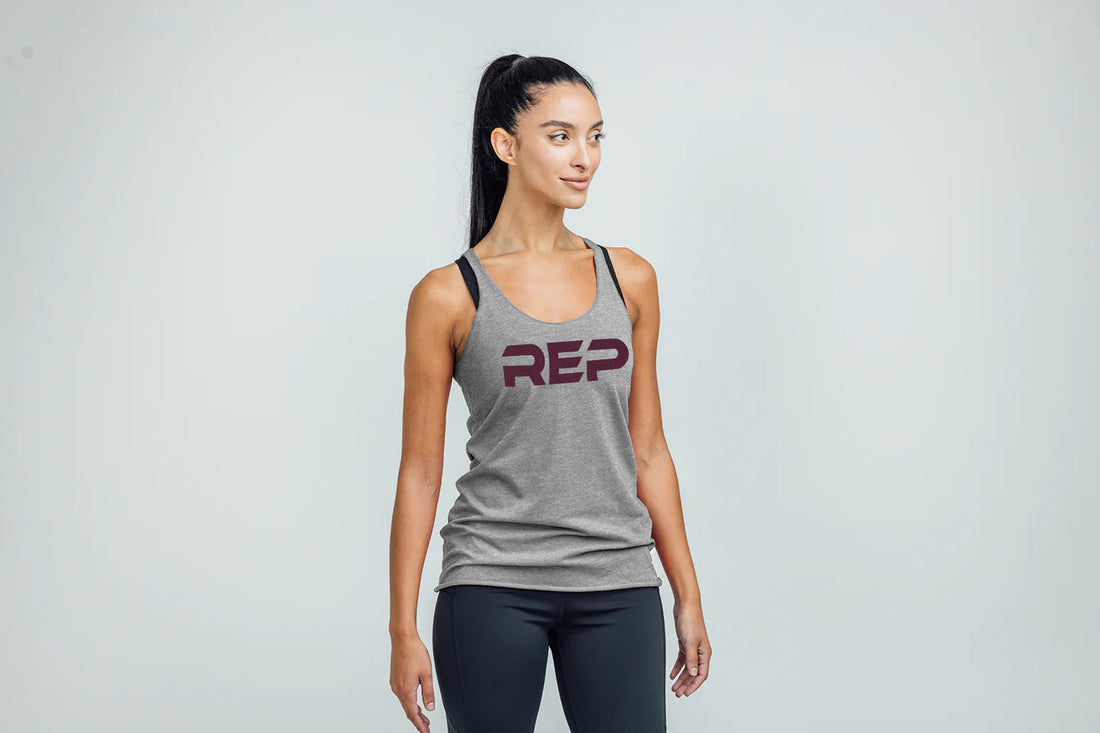 The REP Fitness Women's Daily Driver Tri-Blend Tank in Heather Gray/Wine on body