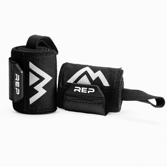 REP Wrist Wraps rolled up to showcase the PVC pull tab and the REP branding