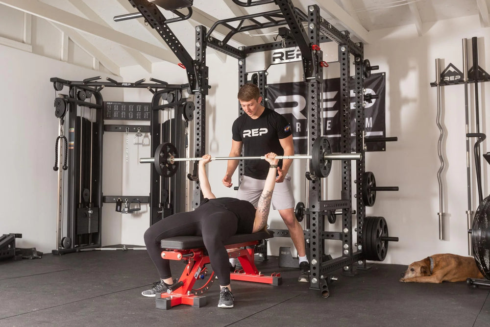 Athlete benching off the front of a PR-5000 rack in Matte Black