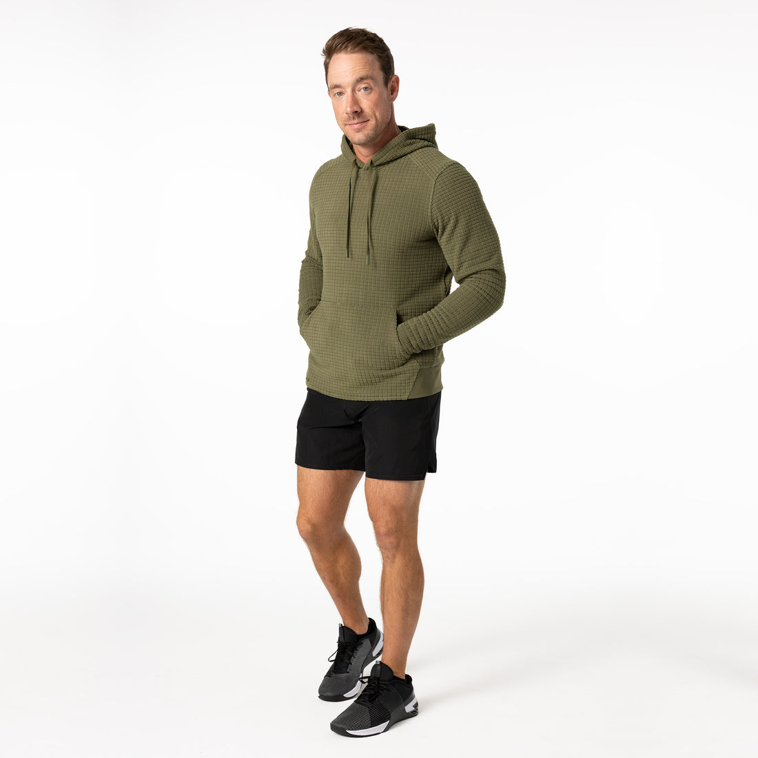 The REP Fitness Men's Stratix Hoodie in Olive hands inside pocket